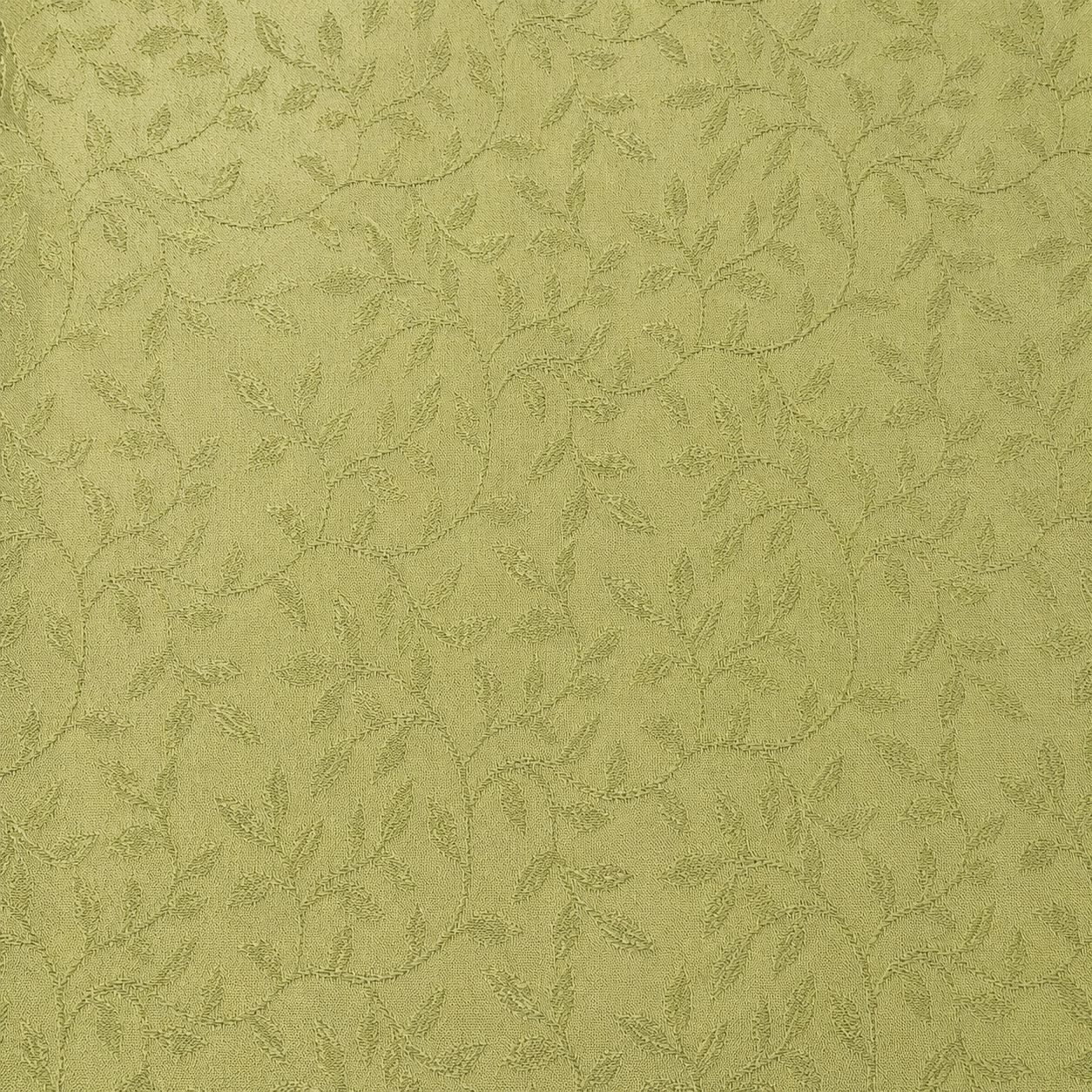 Detailaufnahme eines Jacquard Stoffes mit Blattmuster in Hellgrün