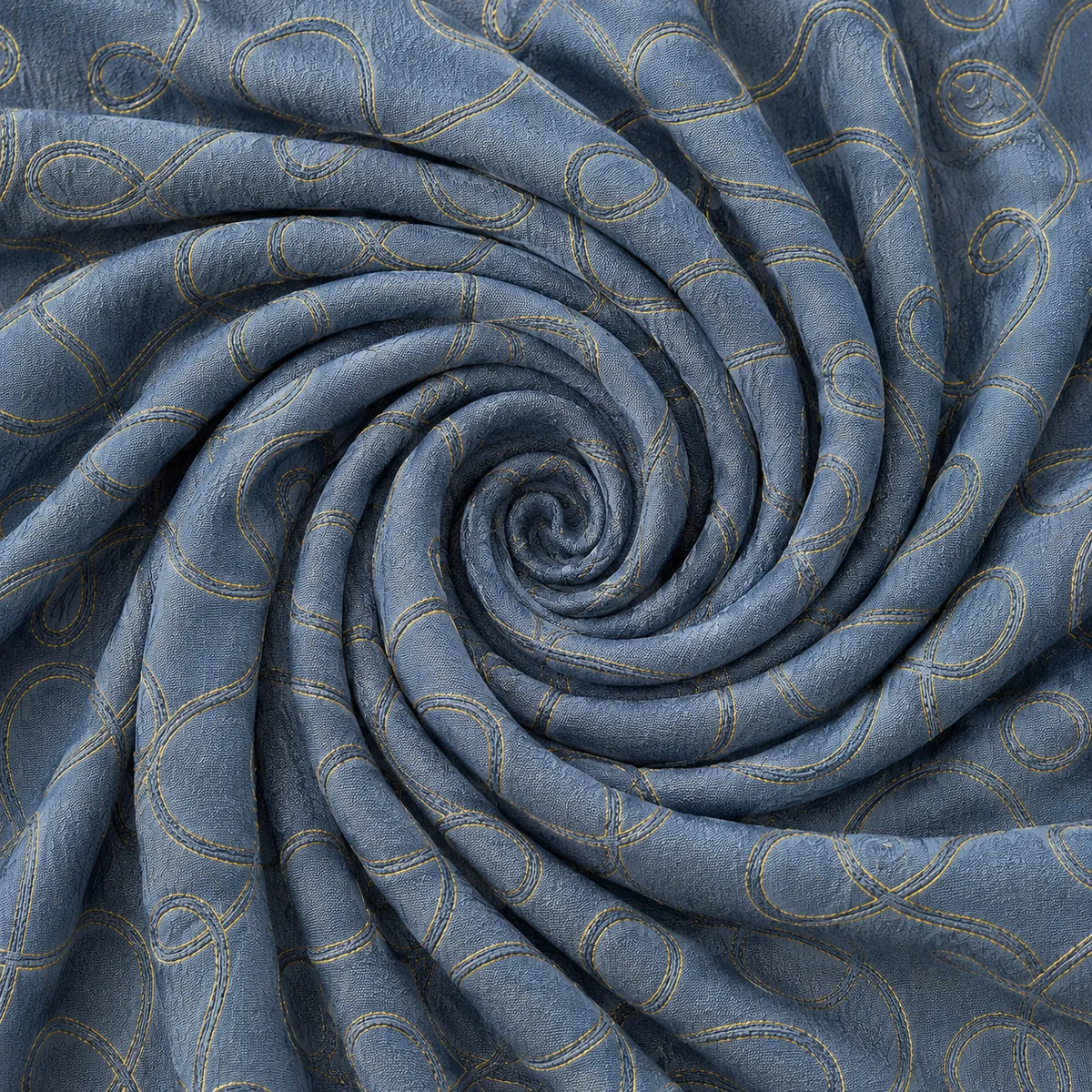 Blauer Polsterstoff aus englischer Manufaktur als Spirale