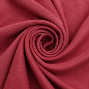 Weinroter Polsterstoff als Spirale aus englischer Manufaktur