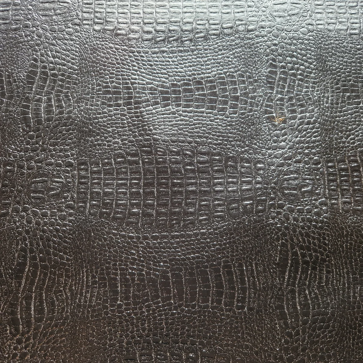 Schwarzer Möbelstoff aus Kunstleder mit Echsenhautoptik